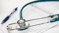 Stethoscope resting on forms