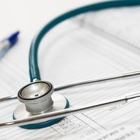 Stethoscope resting on forms